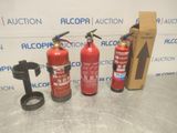 three fire extinguisors are sitting next to each other on a table