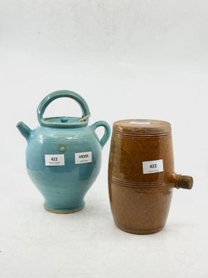 two vases that are next to each other on a table