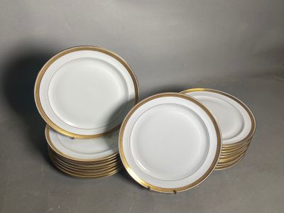 a set of six white and gold plates with gold rims