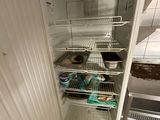 an open refrigerator with a lot of food inside of it