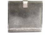 an image of a silver purse sitting on top of a white surface