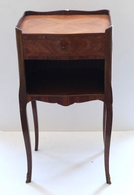 an image of a small table with a drawer on it