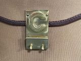 a brown bag that has a metal clasp on it