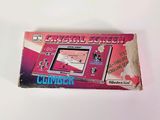 an image of a pink nintendo game console sitting on top of a white table