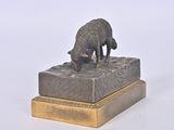 a statue of a sheep that is on top of a box