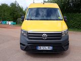 a yellow van that is parked on the side of the road