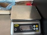 an image of a scale sitting on a kitchen counter