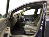 the interior of a car with the door open and the driver ' s seat down