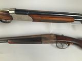 two shotguns are shown on a white surface with a white background