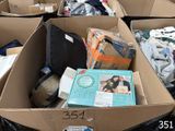 many boxes of clothes and other items in a pile