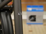 a close up of a bike with a box in the background