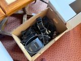 a cardboard box filled with electronic equipment on the floor