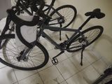 three bikes that are sitting on the floor next to each other