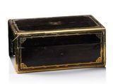 a black and gold box on a white surface