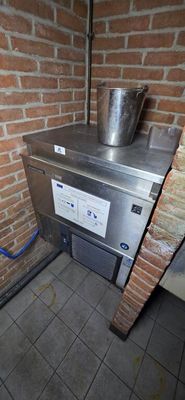 a large metal pot sitting on top of a stove in a kitchen