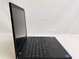 the laptop is open on a white surface with a white background