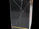 a box with a broken glass on it on a black background