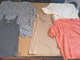 three dresses sitting on a table next to each other