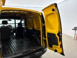 a yellow van with its doors open in a room