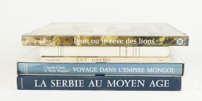 three books stacked on top of each other on a table