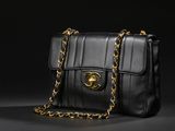 a chanel black leather shoulder bag with gold hardware