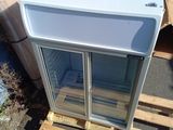 a refrigerator that is sitting on a pallet in the yard