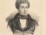 portrait of a man in a suit with a bow tie
