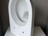 a white urinal sitting on top of a white box