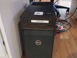 a dell desktop computer sitting on a hard wood floor