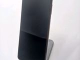 a cell phone that is sitting on a stand