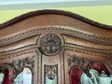 a wooden china cabinet with a mirror in it