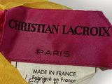christian lacrox label on a yellow and pink dress