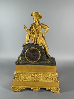 an image of a gold clock with a statue on top of it