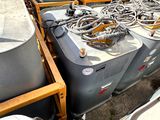 many different types of tanks and hoses on the side of the road