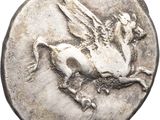 a close up of a silver coin with a horse on it