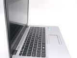a close up of a laptop computer on a white surface