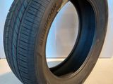 a close up of a tire on a white surface