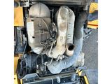 a close up of the engine of a construction vehicle