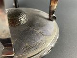 a close up of a metal object on a table