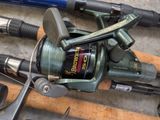 a fishing rod and a fishing reel on a table