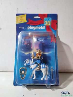 a toy figure of a knight on a horse