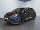 the purple car is parked in the showroom in front of a white wall
