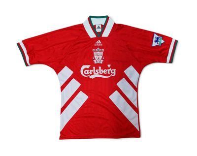 a close up of a red and white soccer jersey with a star on the chest
