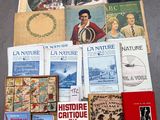 un grand nombre de livres posés sur le sol
