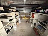 many bottles of wine on the shelves in the room