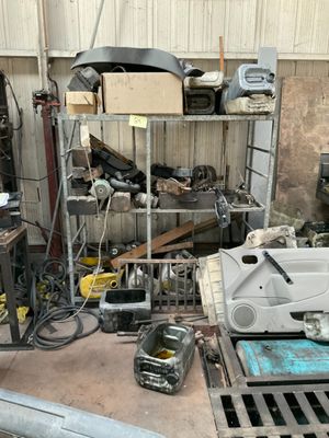a picture of a garage with a lot of tools on the floor
