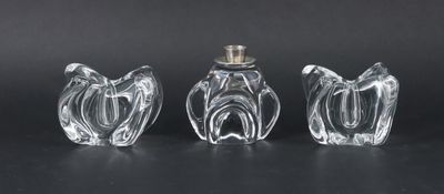 three glass vases sitting on top of a table next to each other