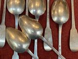 a lot of spoons and spoon spoons on the table