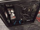 a black computer case with a keyboard on top of it