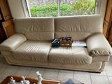 a couch and a table with chess pieces on it in a living room